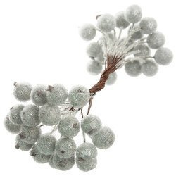 Frosted silver berries of mountain ash on a thin wire. 